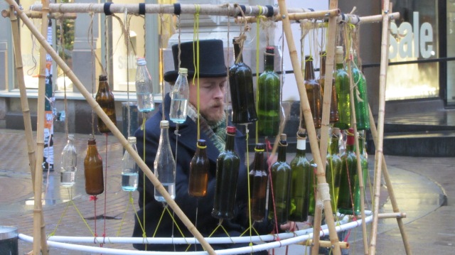 A man playing tunes on his bottles