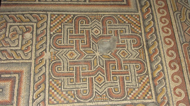 Old mosaic floors under the stone floor of the Church of the Nativity