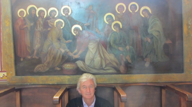 Solihin in front of mural in the church by Galilee