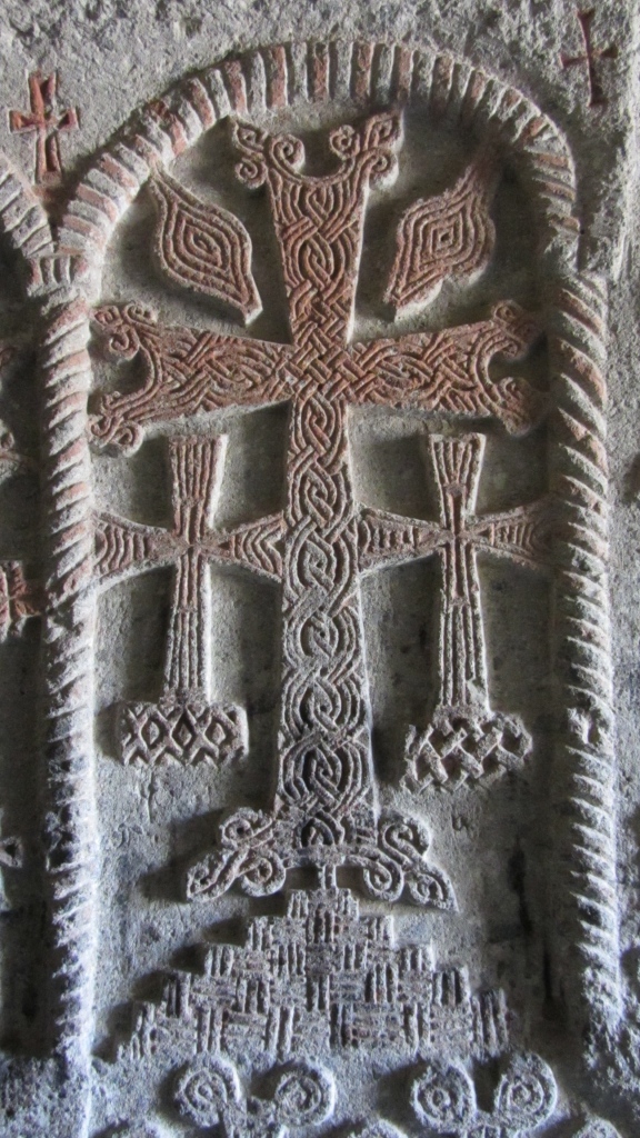 Beautifully carved cross in stone colored with cochineal hundreds of years ago
